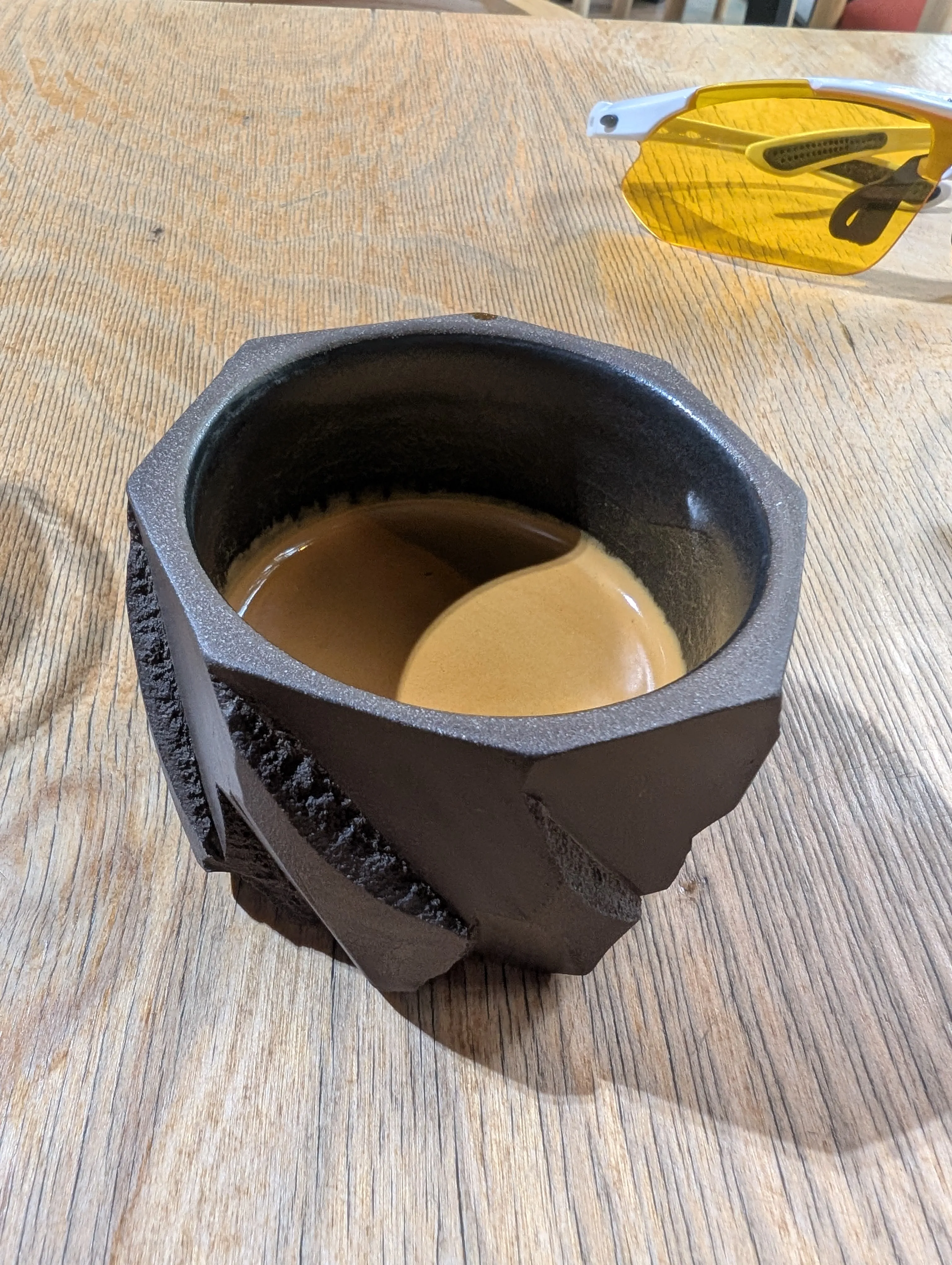 Espresso in a faceted dark ceramic cup at Jump-in-Goat