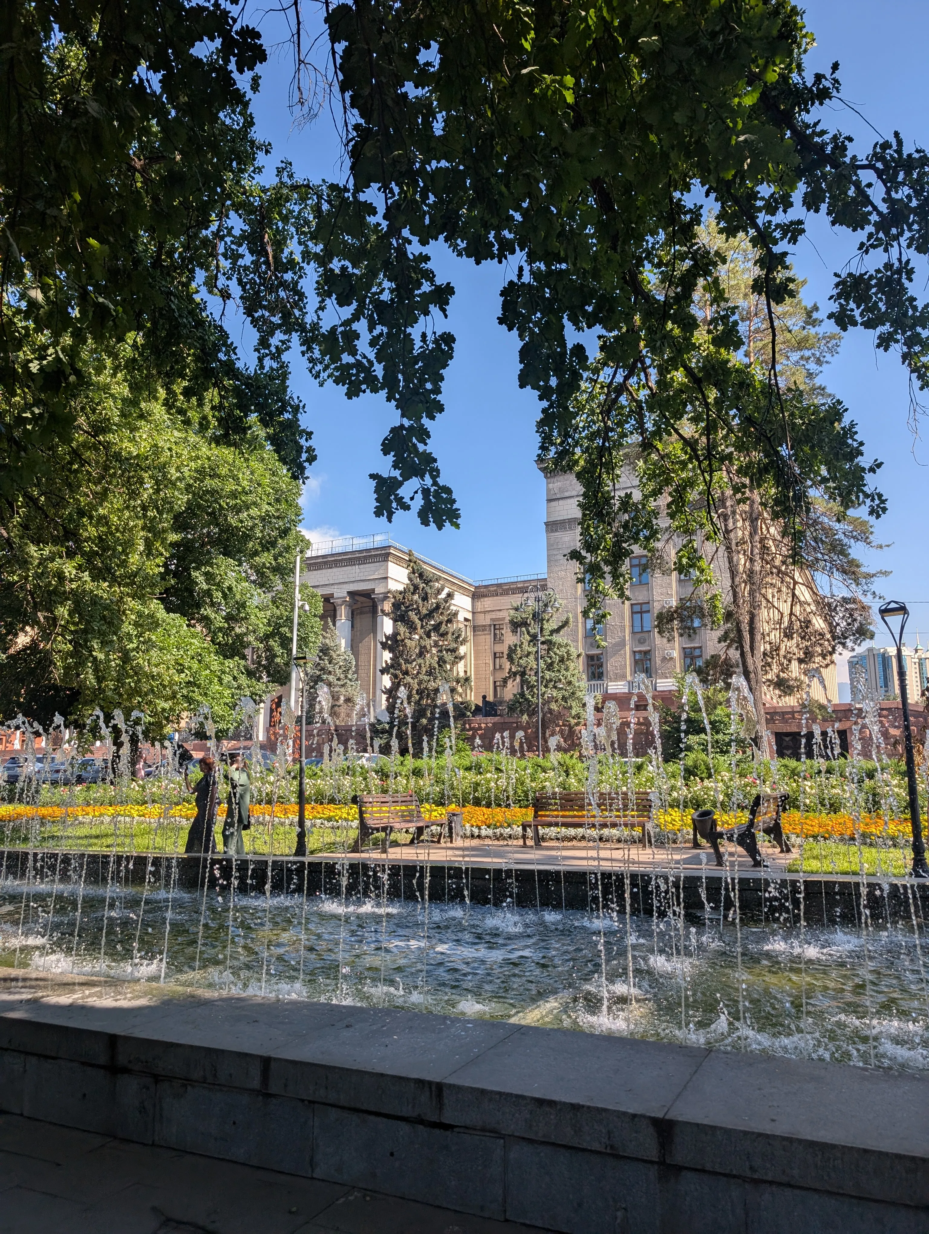 The columned portico of the former House of Government seen across its fountains